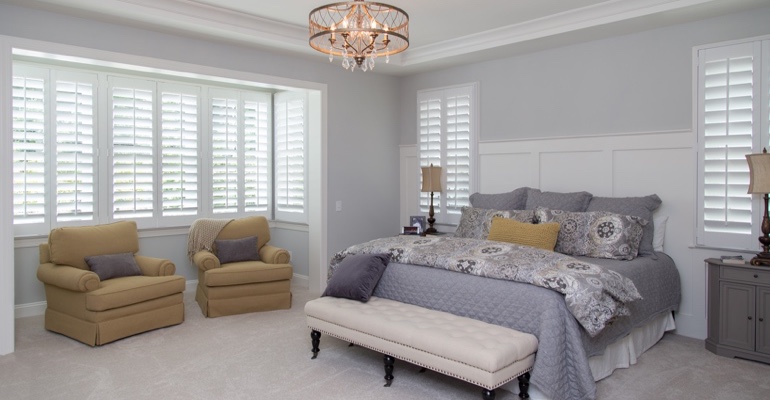 Plantation shutters in San Diego bedroom.